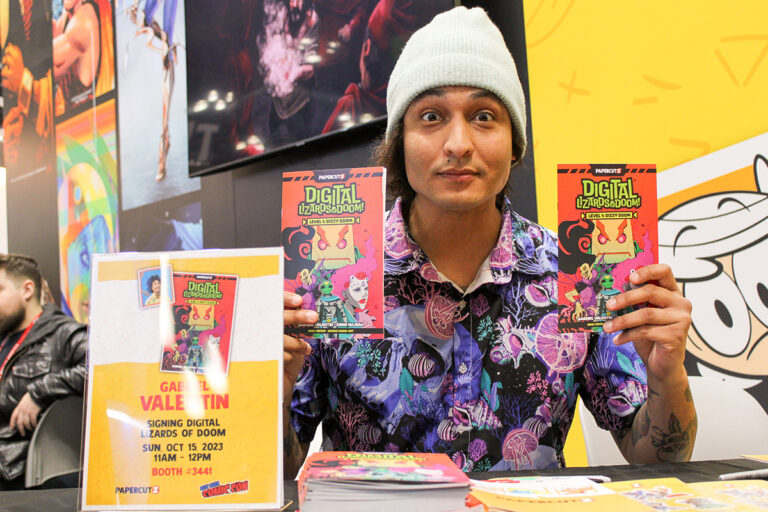 Gabriel Valentin signing and previewing his upcoming graphic novel, Digital Lizards of Doom, at New York Comic Con 2023