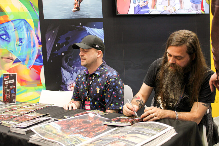 Chas! Pangburn and Kelly Williams signing a sneak preview of Skeeters at New York Comic Con